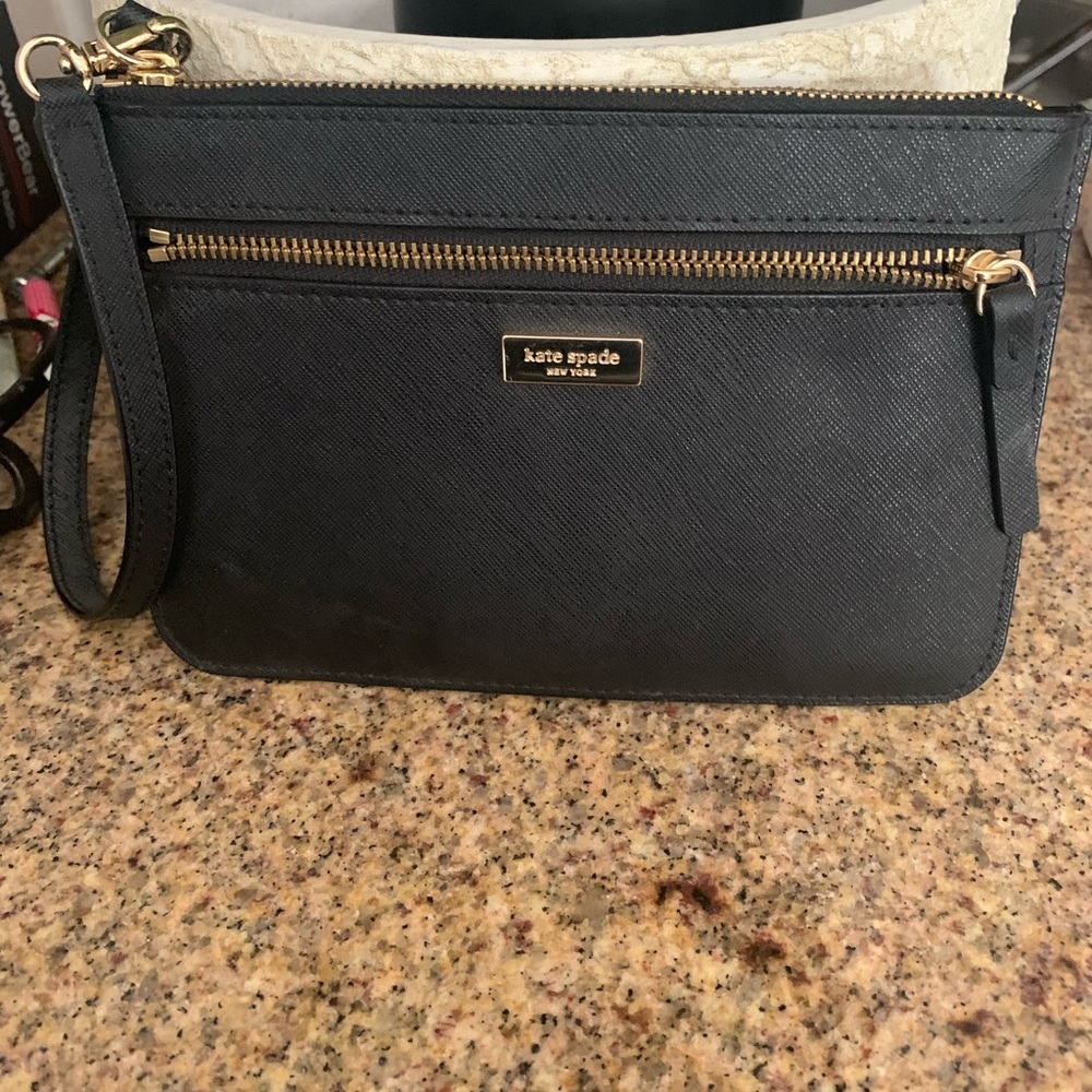 Brand new Kate Spade wristlet with gold hardware.